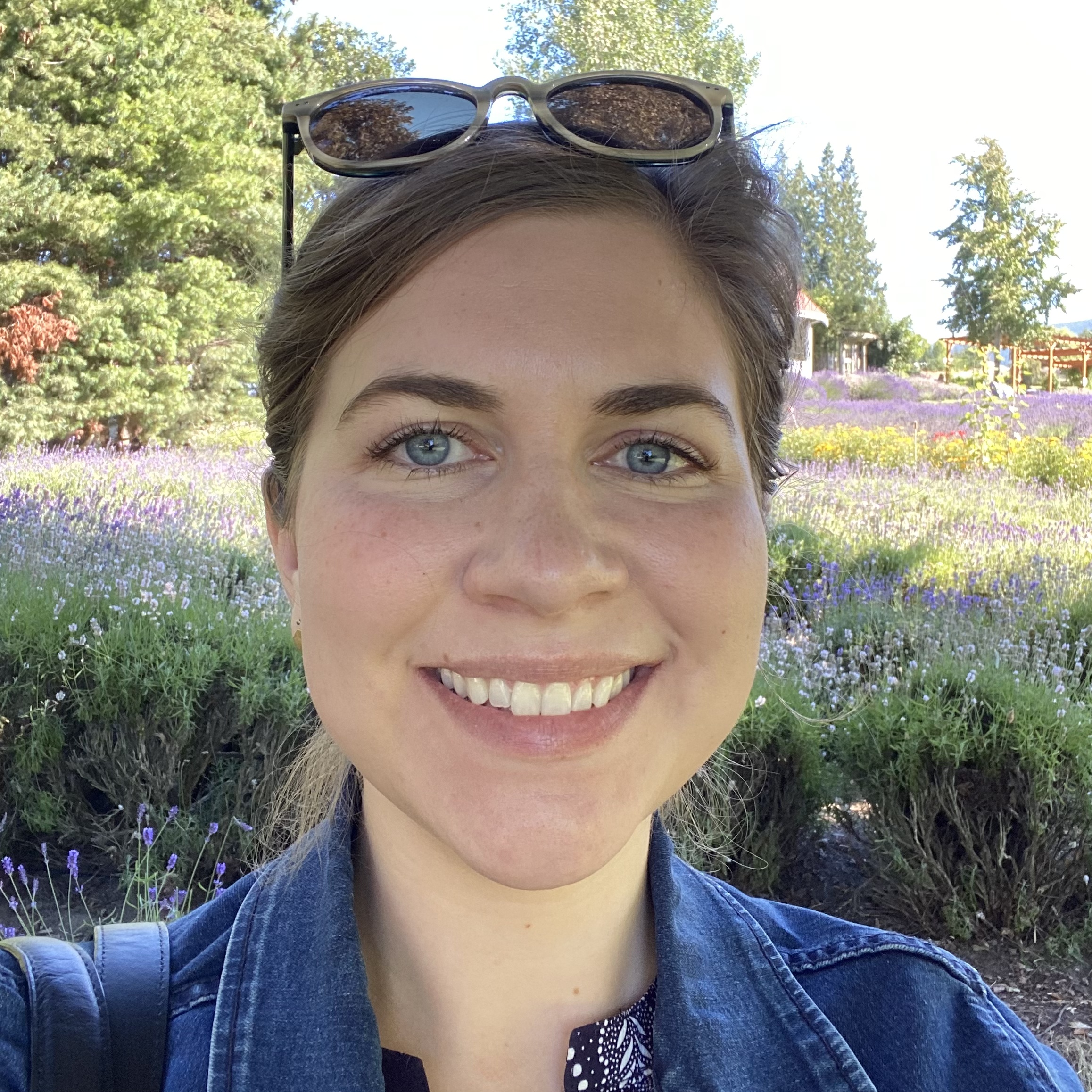 Headshot of Rebecca Stewart, with lavender fields in the background.