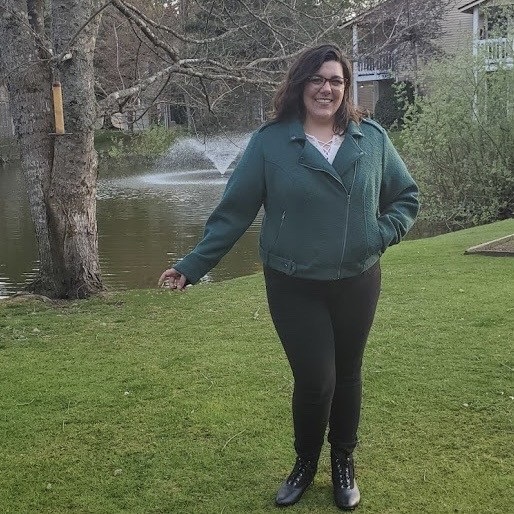 Photo of Bethany McKinley standing in front of a pond.